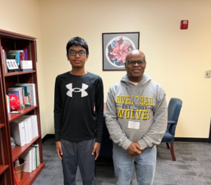 FCS Spelling Bee champion Aryan Batchu with River Trail Middle School Principal Neil Pinnock